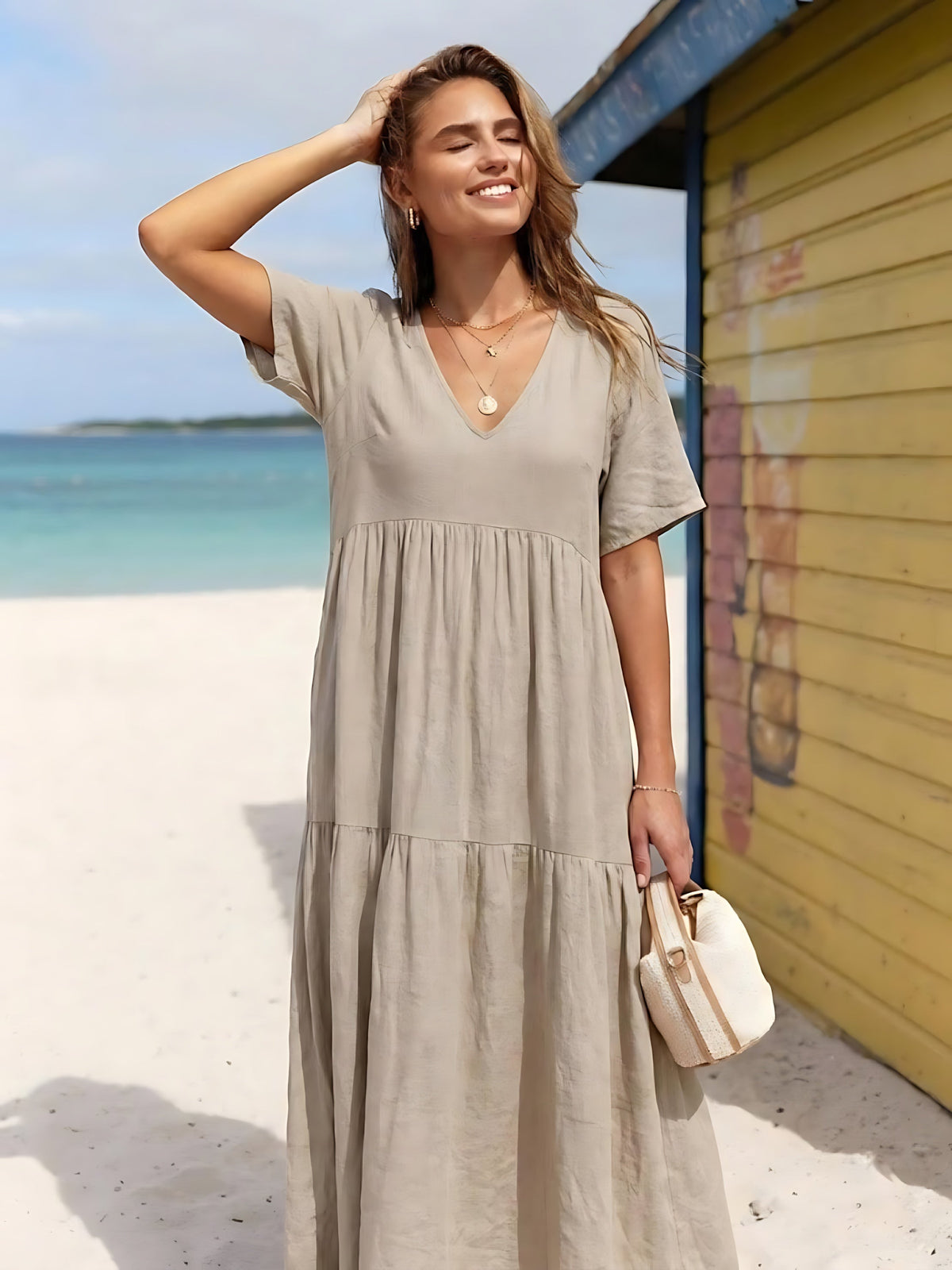 Woman wearing a V-neck tiered maxi dress with short sleeves - view 28