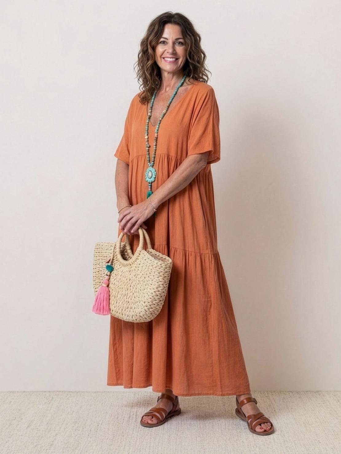 Woman wearing a V-neck tiered maxi dress with short sleeves - view 3