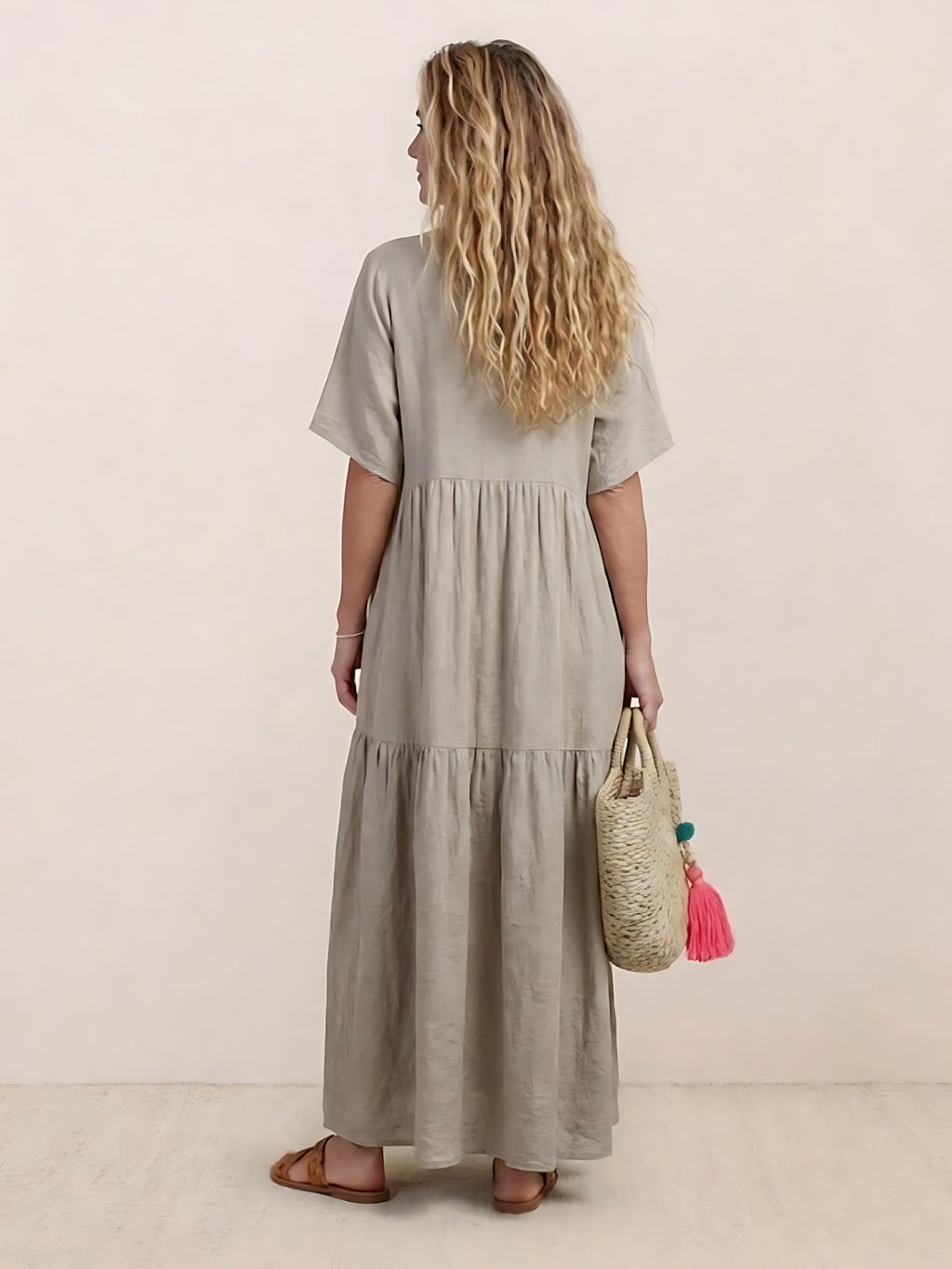 Woman wearing a V-neck tiered maxi dress with short sleeves - view 32