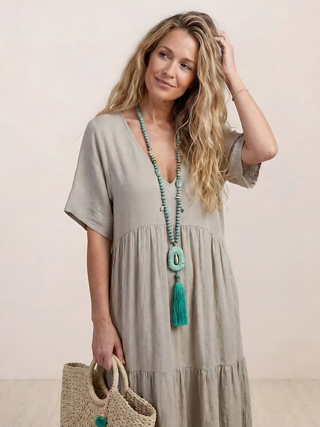 Woman wearing a V-neck tiered maxi dress with short sleeves - view 34