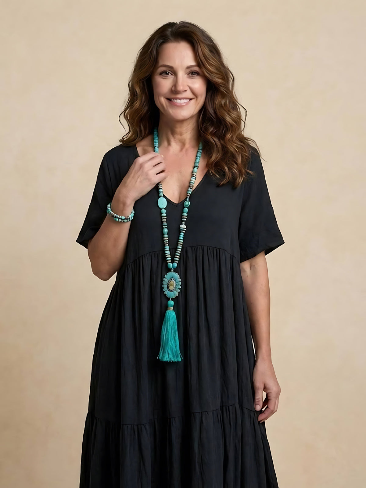 Woman wearing a V-neck tiered maxi dress with short sleeves - view 37