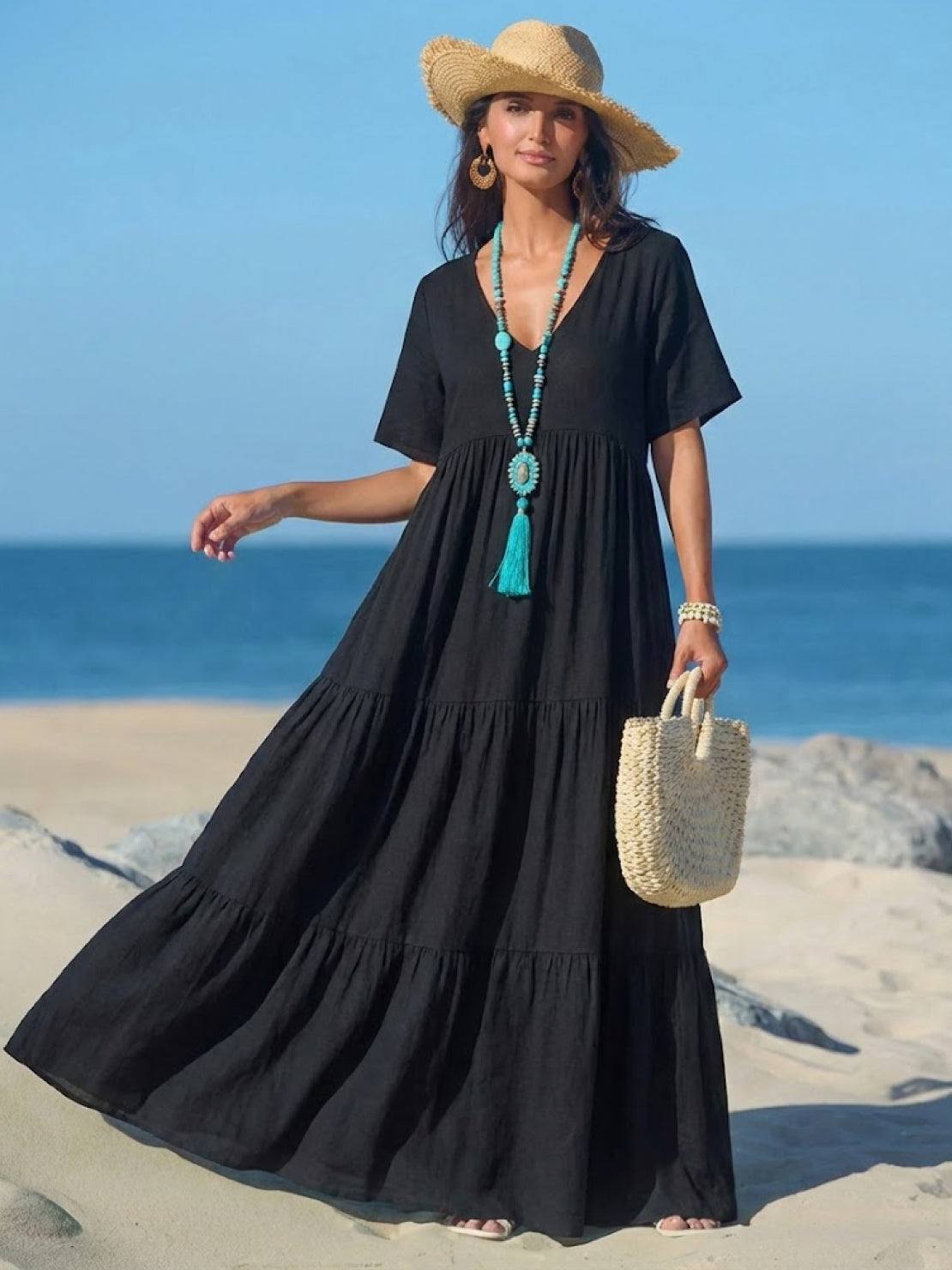 Woman wearing a V-neck tiered maxi dress with short sleeves - view 38