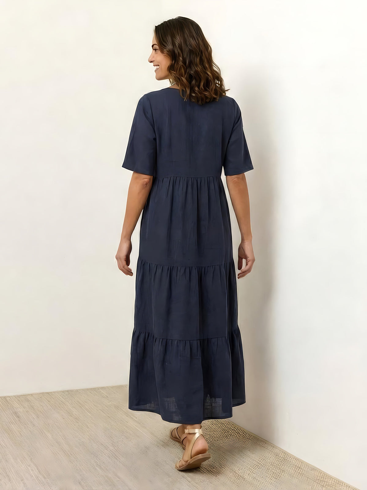 Woman wearing a V-neck tiered maxi dress with short sleeves - view 39