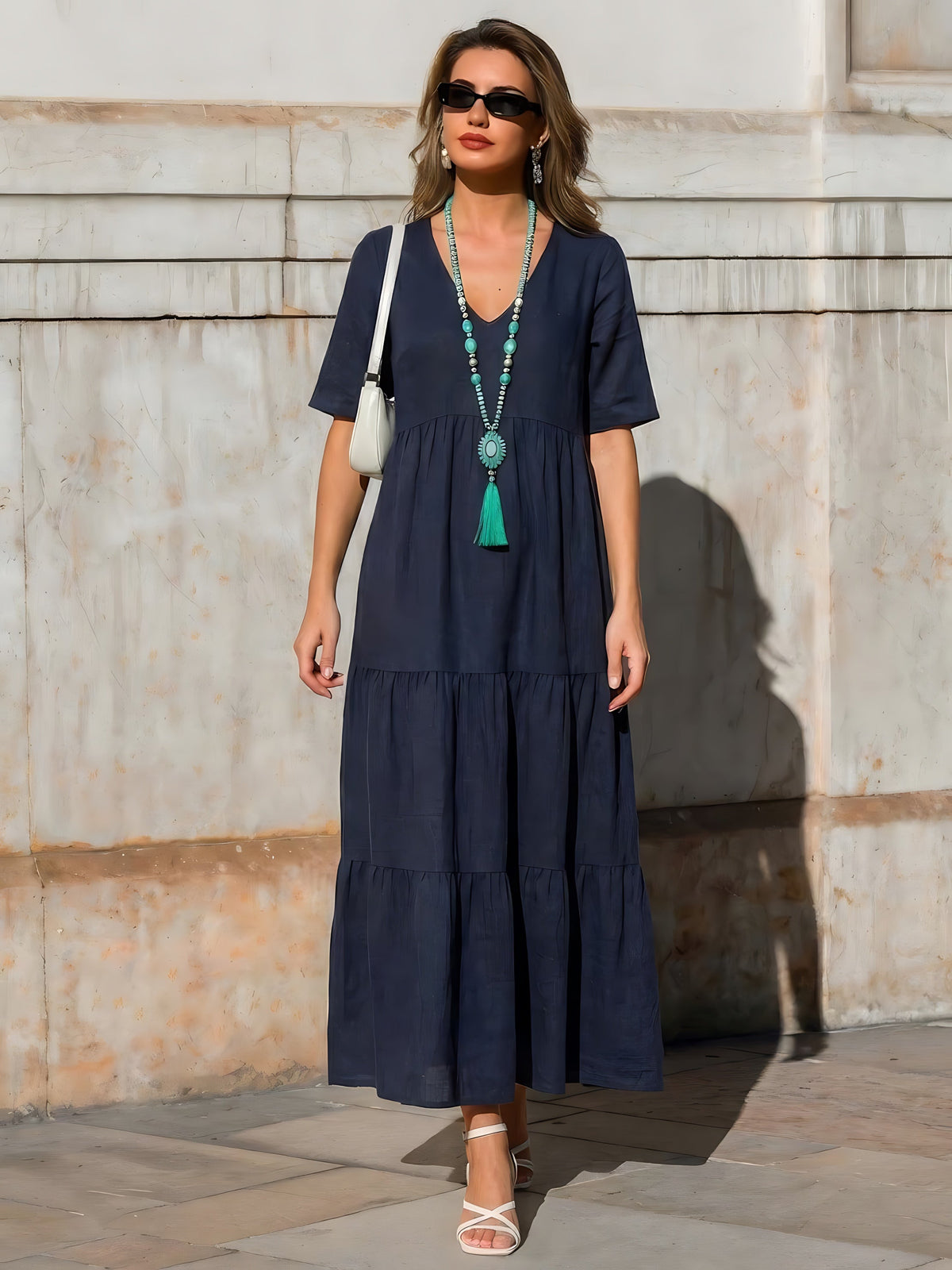 Woman wearing a V-neck tiered maxi dress with short sleeves - view 40