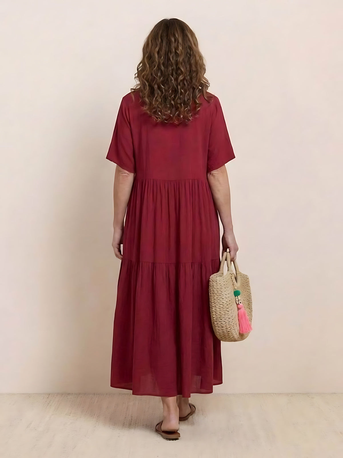 Woman wearing a V-neck tiered maxi dress with short sleeves - view 44