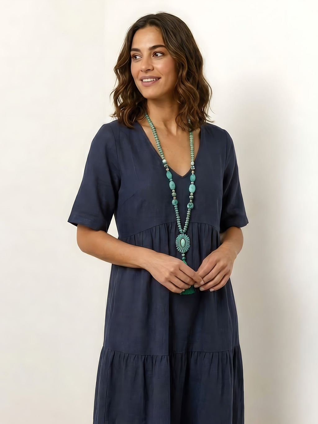 Woman wearing a V-neck tiered maxi dress with short sleeves - view 51