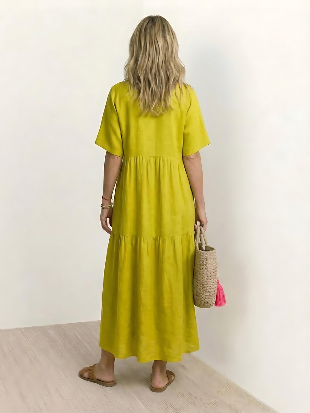 Woman wearing a V-neck tiered maxi dress with short sleeves - view 64