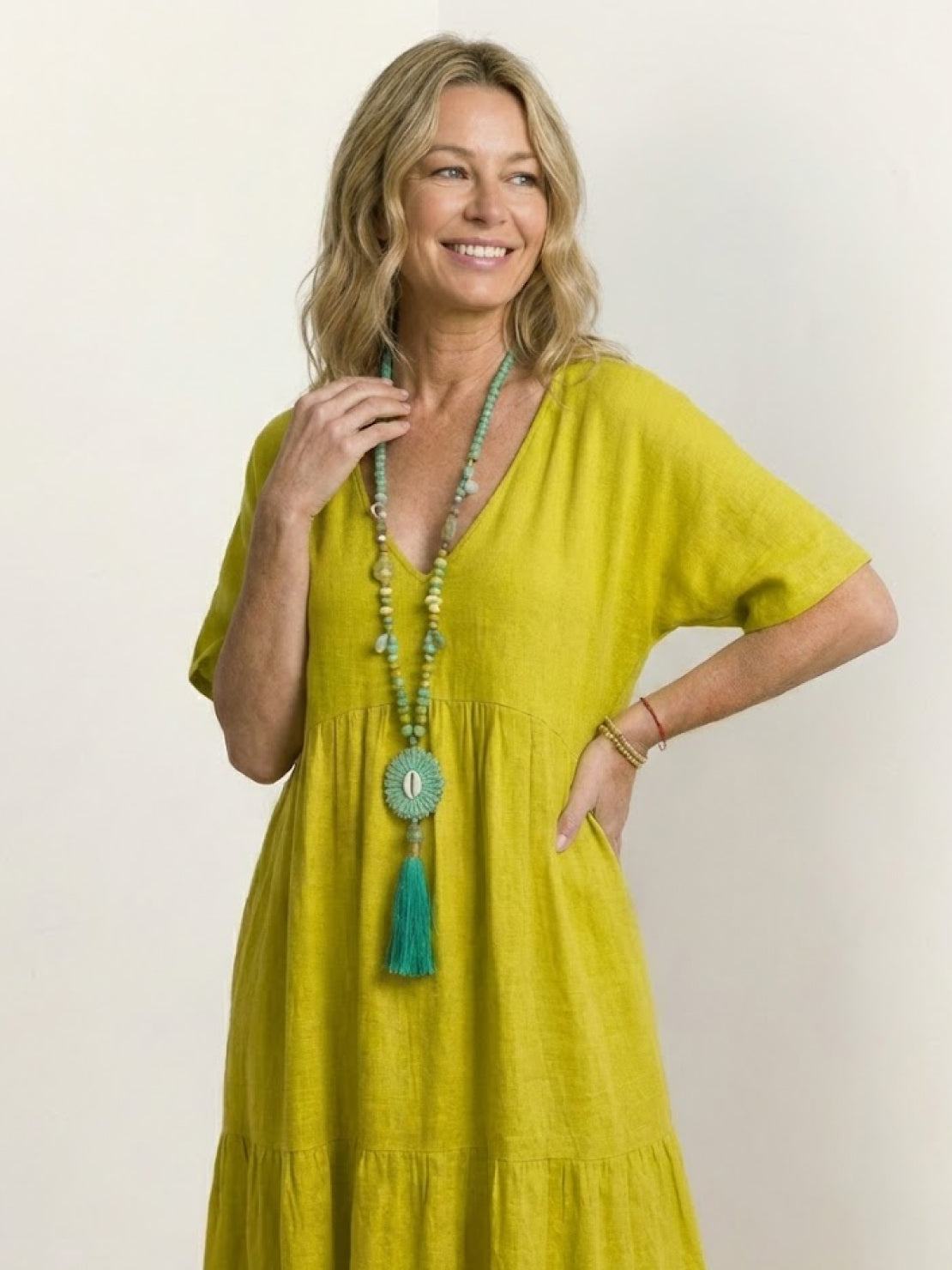 Woman wearing a V-neck tiered maxi dress with short sleeves - view 65