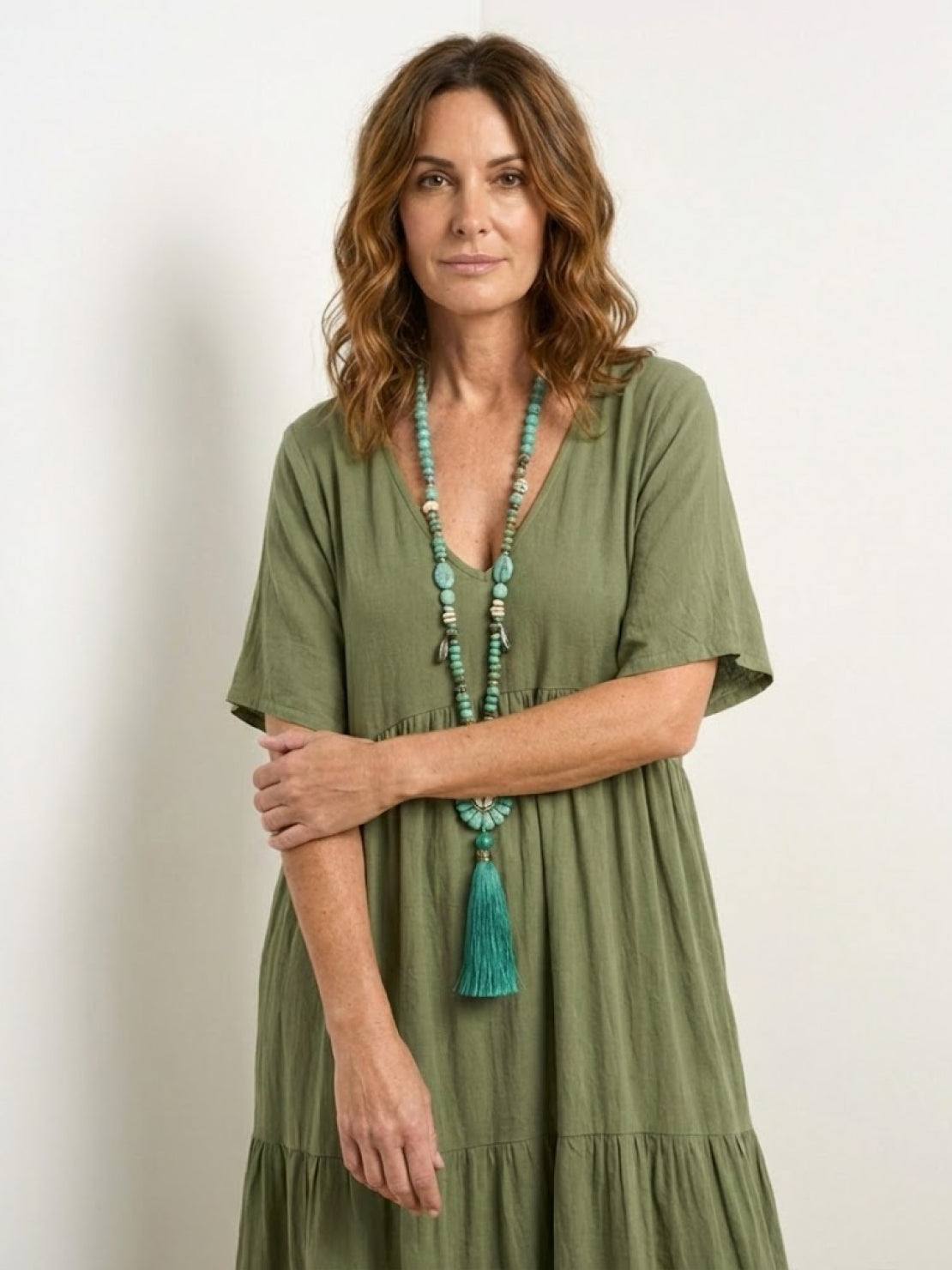 Woman wearing a tiered V-neck maxi dress with short sleeves - view 16