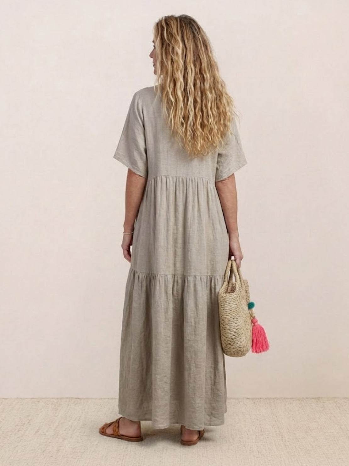 Woman wearing a tiered V-neck maxi dress with short sleeves - view 19