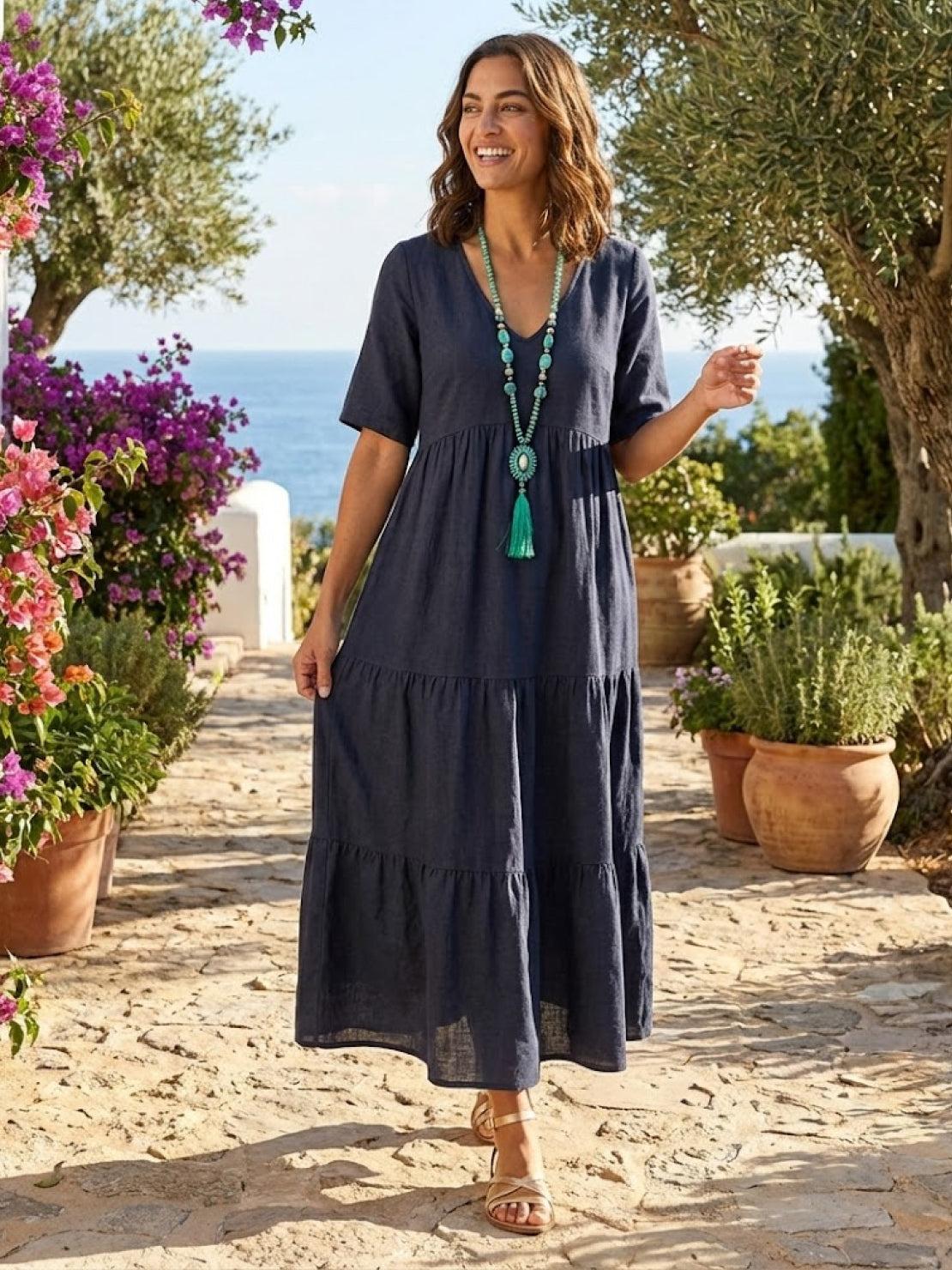 Woman wearing a tiered V-neck maxi dress with short sleeves - view 26