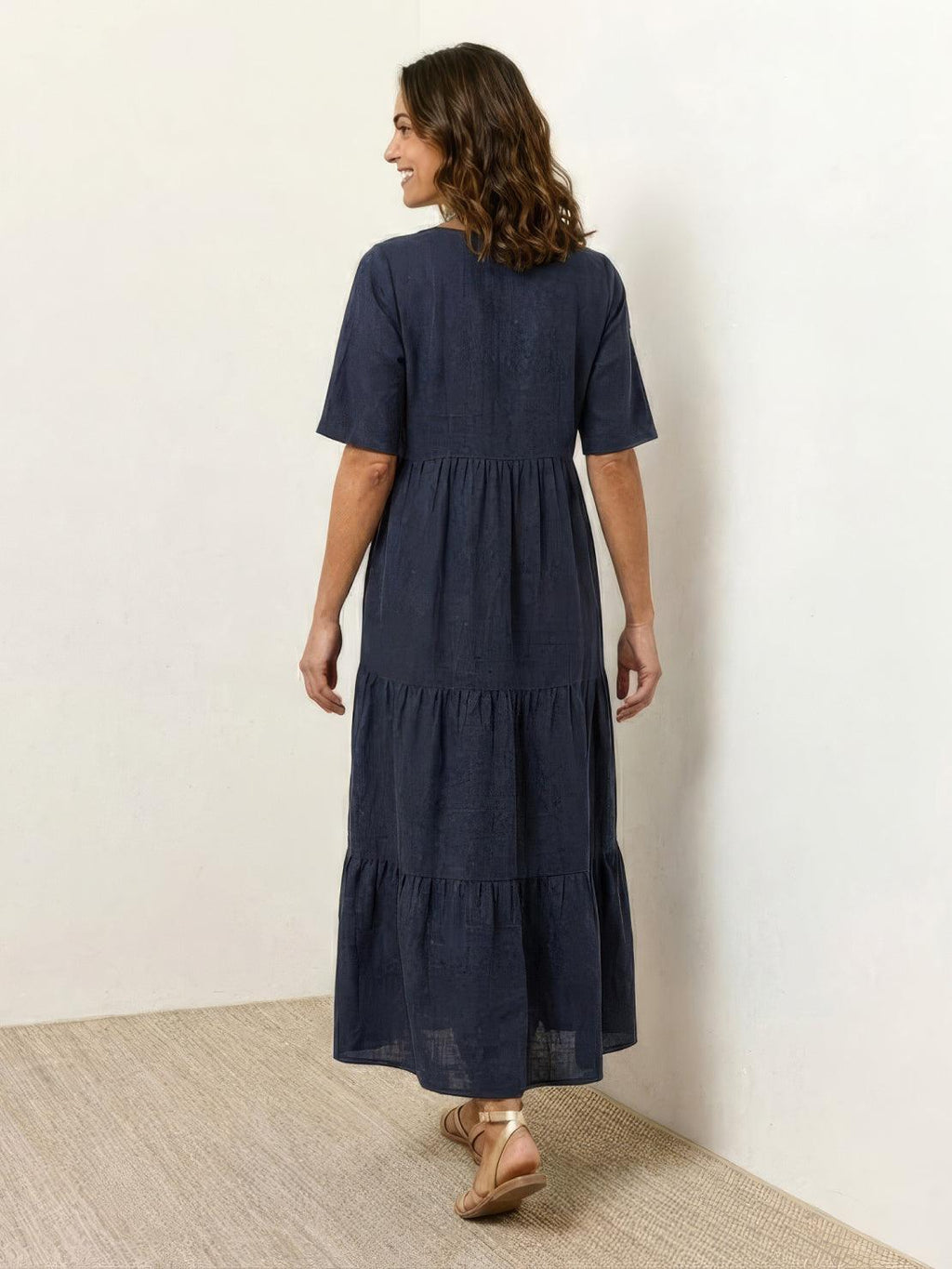 Woman wearing a tiered V-neck maxi dress with short sleeves - view 27