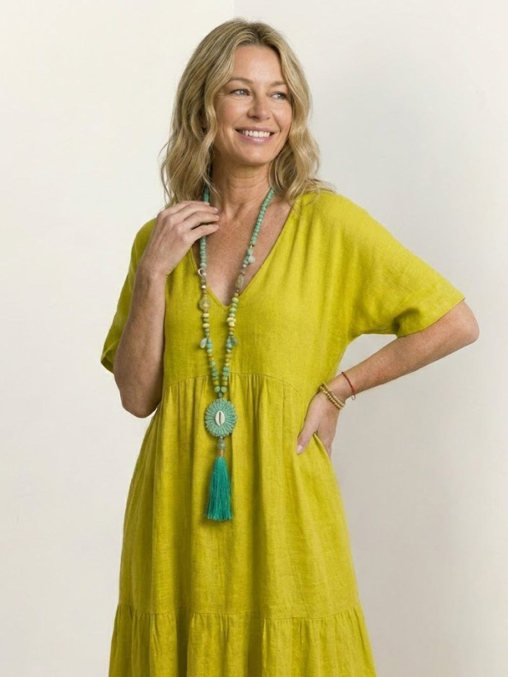 Woman wearing a tiered V-neck maxi dress with short sleeves - view 40