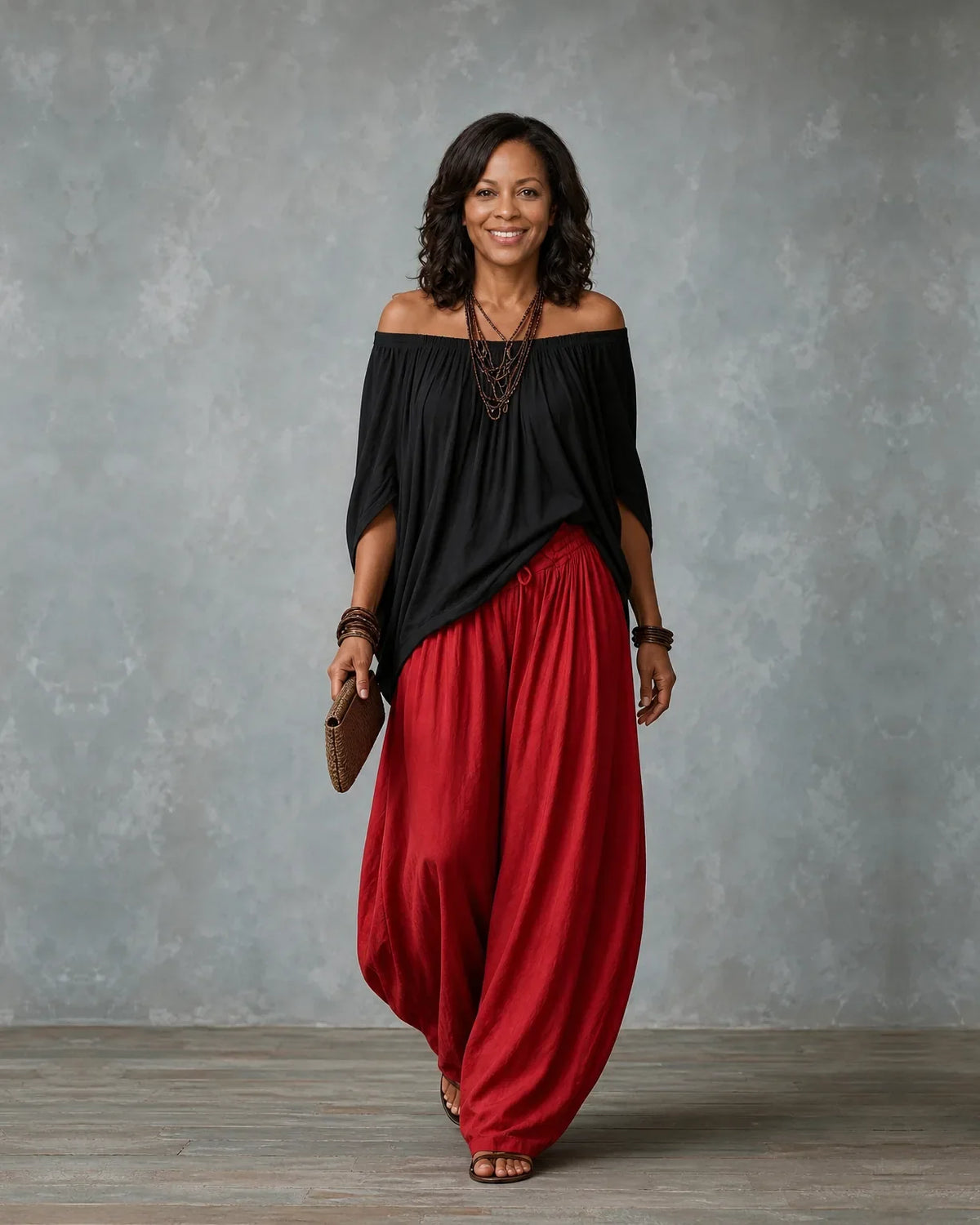 Woman in an off shoulder two piece set with split sleeves and balloon wide leg pants - view 4
