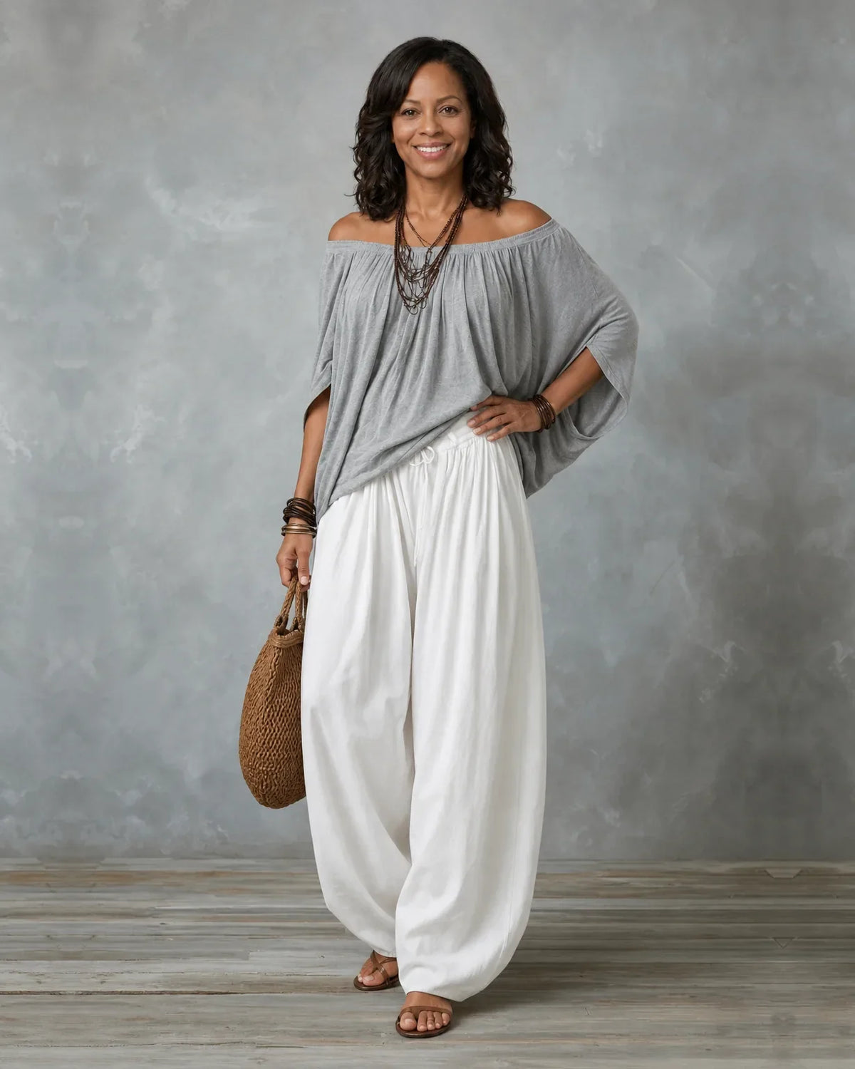 Woman in an off shoulder two piece set with split sleeves and balloon wide leg pants - view 6