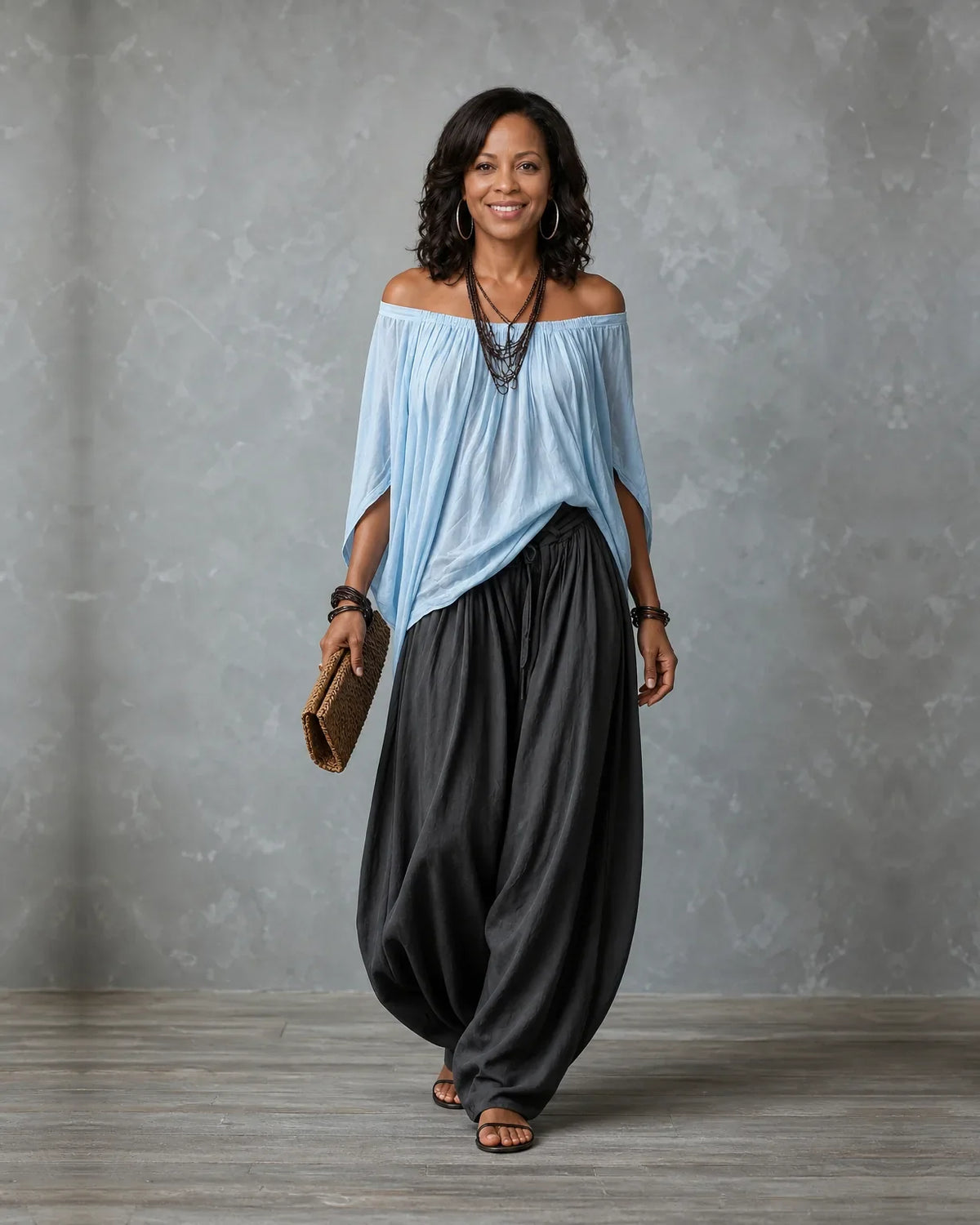 Woman in an off shoulder two piece set with split sleeves and balloon wide leg pants - view 8