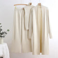 Woman wearing a three piece knit set with longline cardigan, ribbed mock-neck top and wide leg pants - view 11