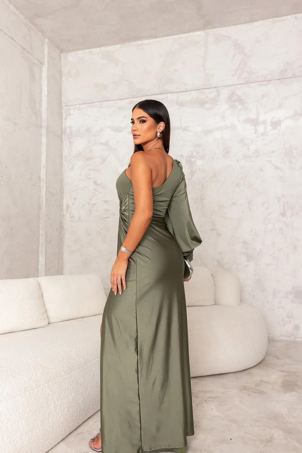 Woman wearing a one shoulder satin formal maxi dress with split sleeve and front slit - view 12
