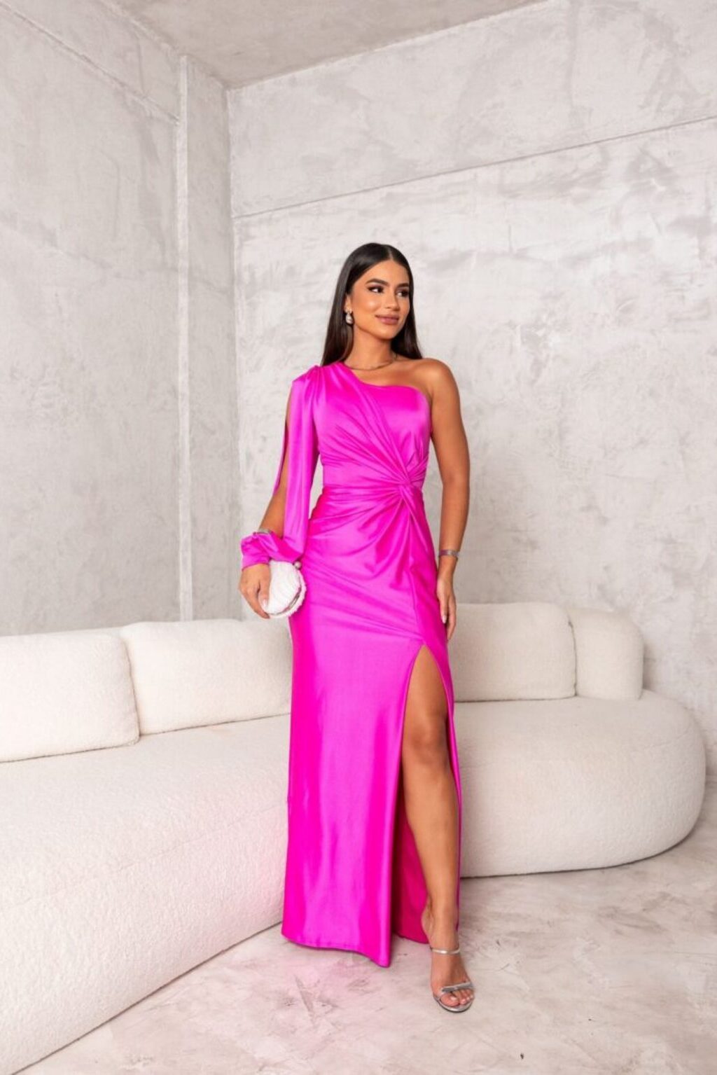 Woman wearing a one shoulder satin formal maxi dress with split sleeve and front slit - view 15