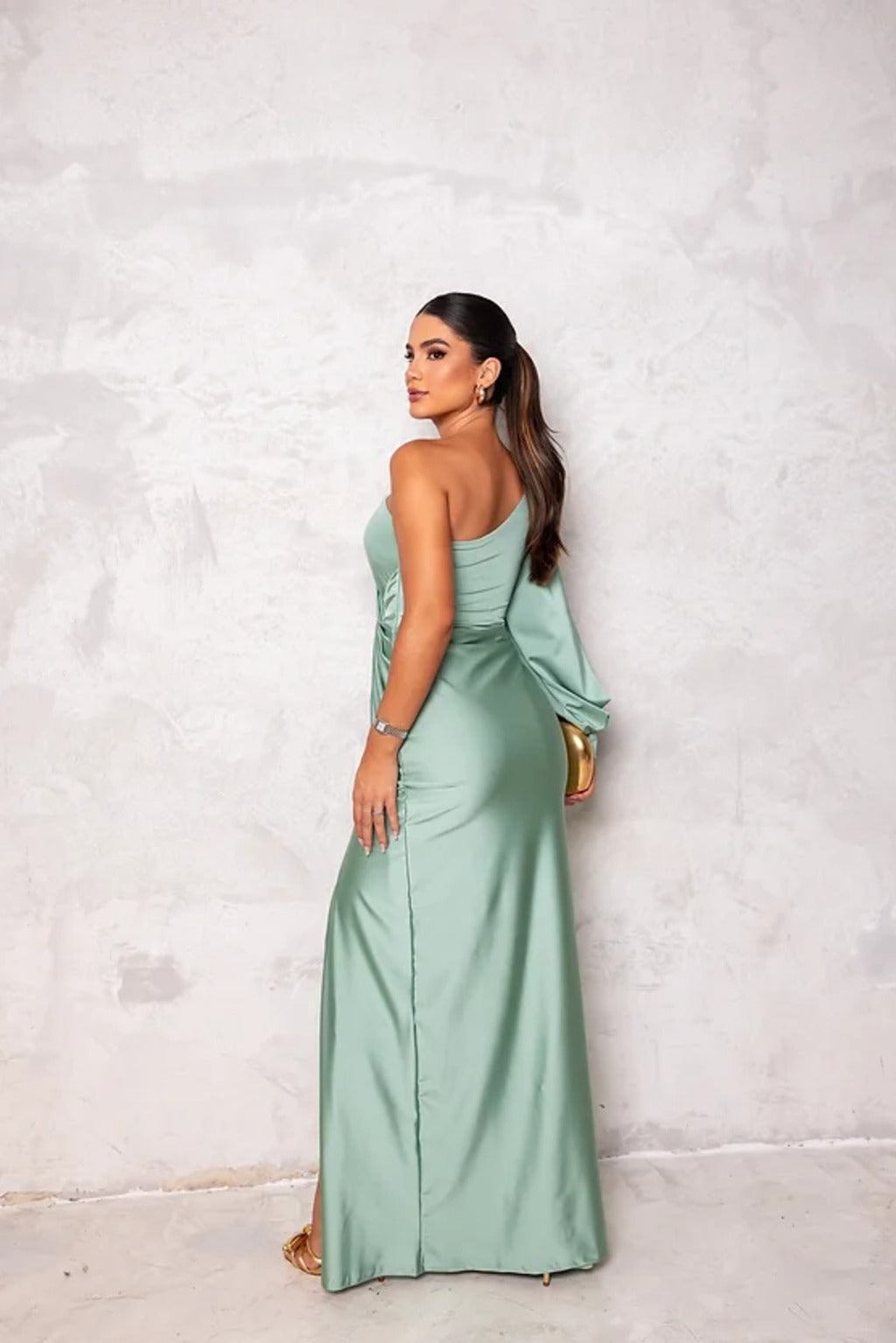 Woman wearing a one shoulder satin formal maxi dress with split sleeve and front slit - view 5