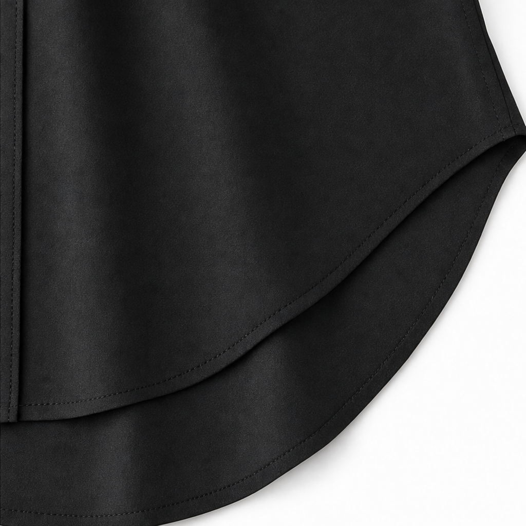 Woman wearing a long sleeve button-front shirt dress with roll-tab sleeves and a curved high-low hem - view 11