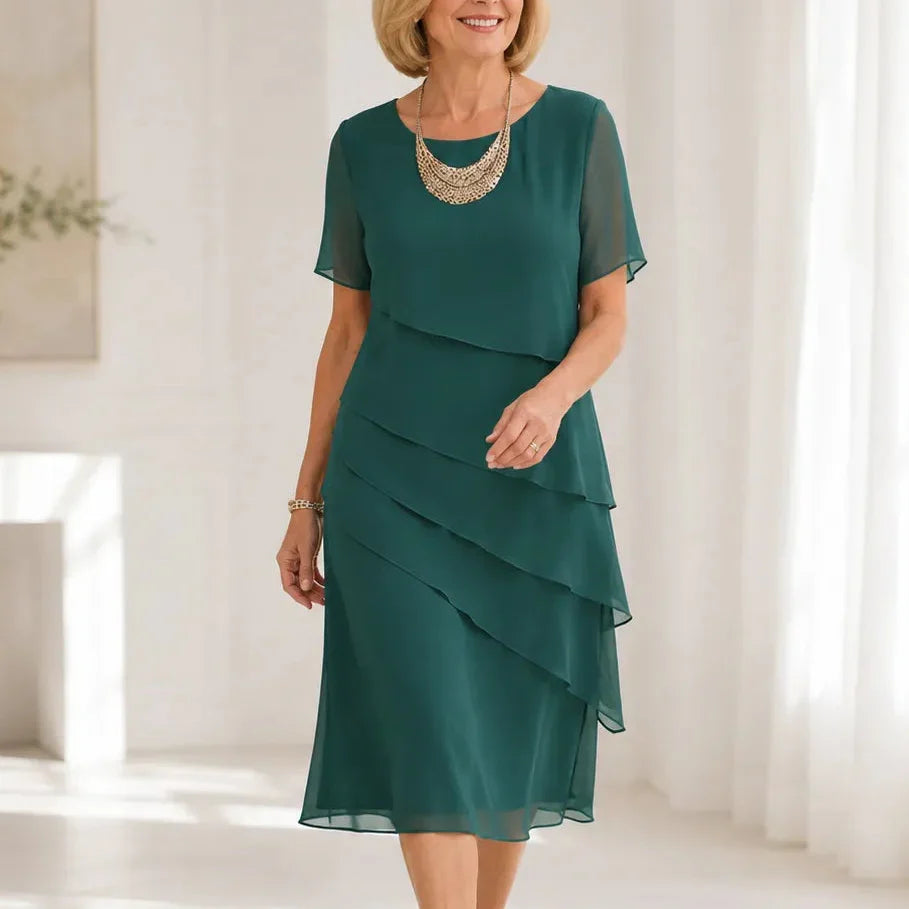 Woman wearing a tiered midi dress with sheer short sleeves for a formal event - view 13