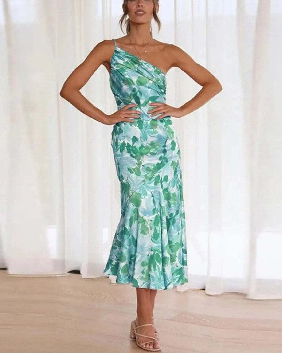 Woman wearing a one-shoulder floral print satin midi dress with draped bodice and fluted hem - view 3