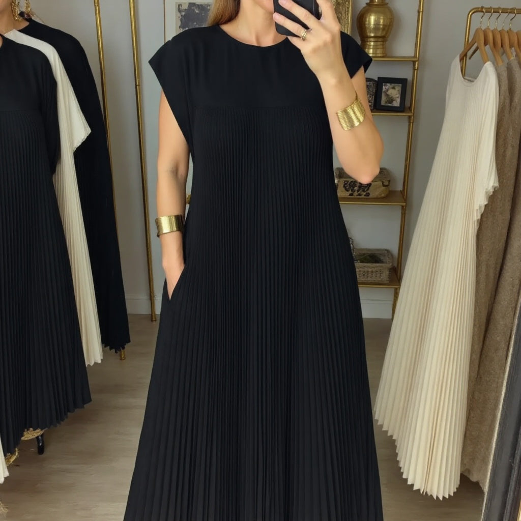 Woman wearing a pleated cocktail maxi dress with round neck and cap sleeves - view 11