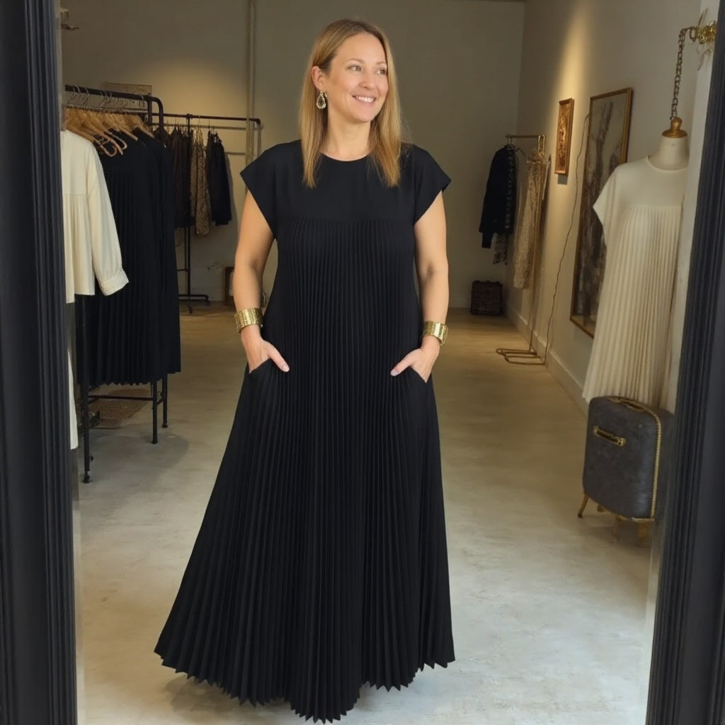 Woman wearing a pleated cocktail maxi dress with round neck and cap sleeves - view 12