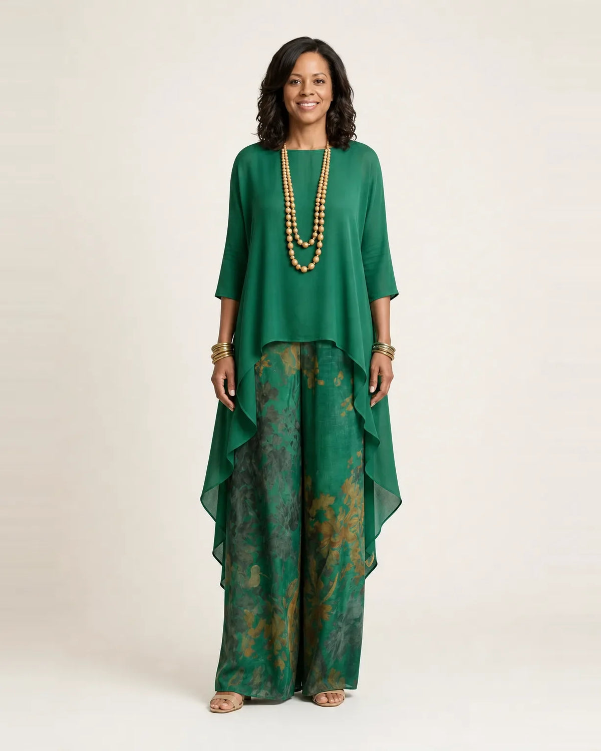Woman wearing a two piece set with an asymmetric tunic and wide-leg floral pants - view 3