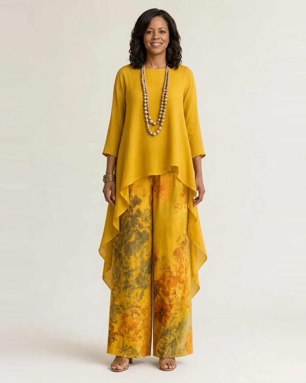 Woman wearing a two piece set with an asymmetric tunic and wide-leg floral pants - view 4