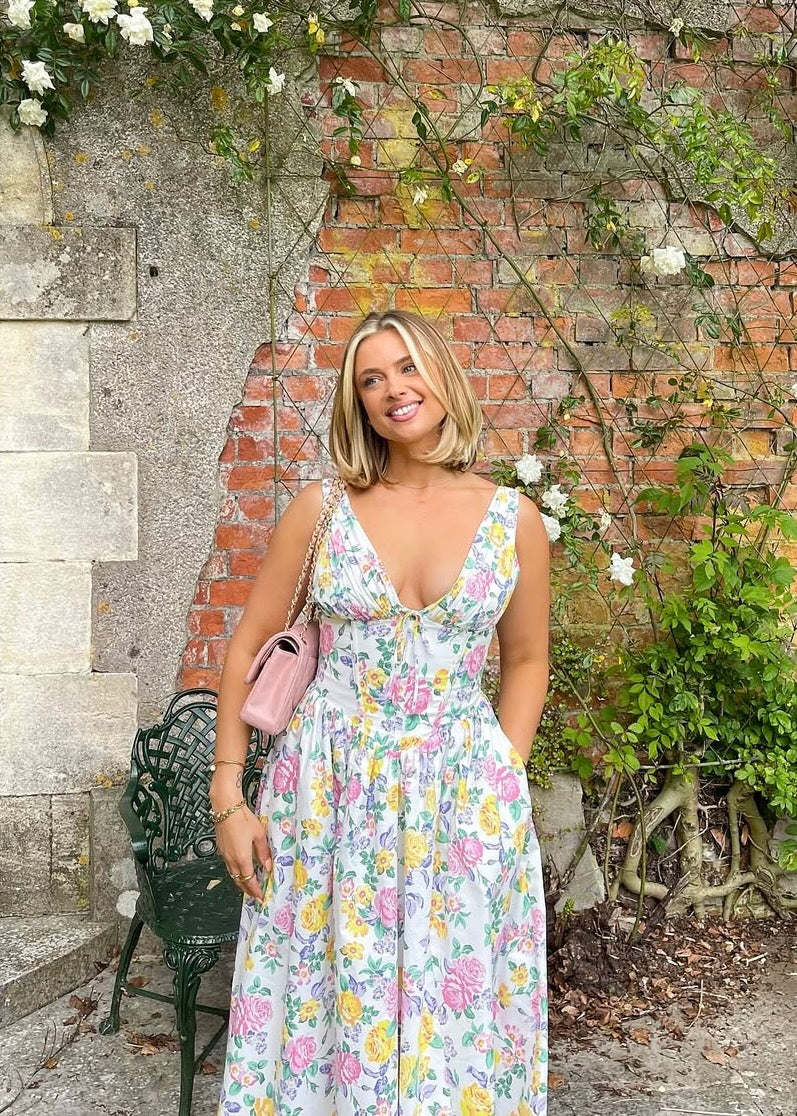 Woman wearing a sleeveless corset midi dress with a V-neck, tie bow and full gathered skirt - view 5