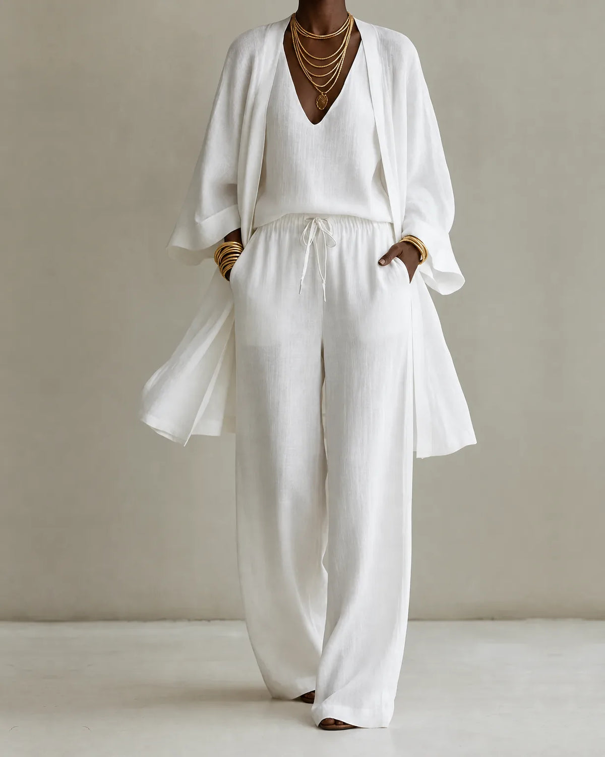 Women's three piece set with V-neck top, drawstring wide leg pants and long open-front cover-up