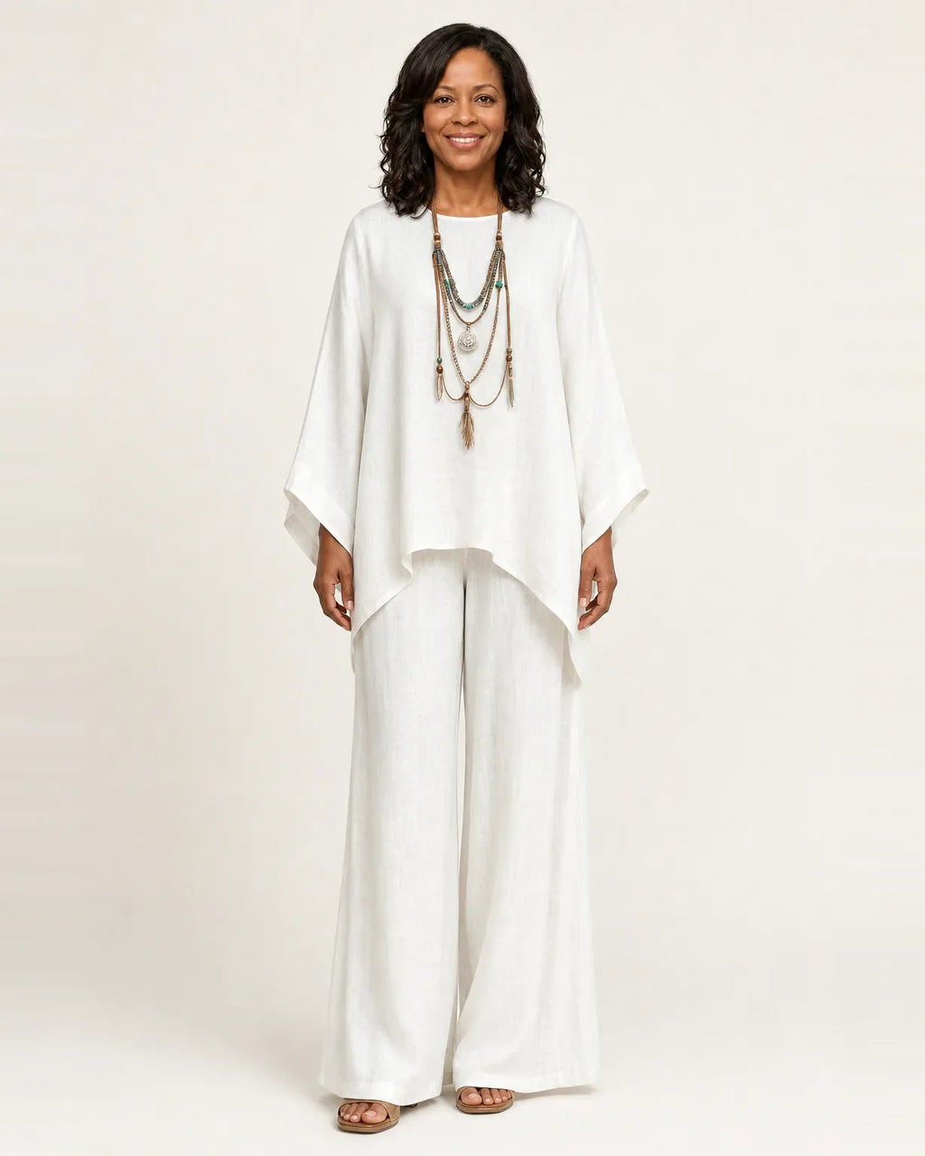 Woman wearing a boho two piece set with an oversized asymmetric top and wide-leg pants
