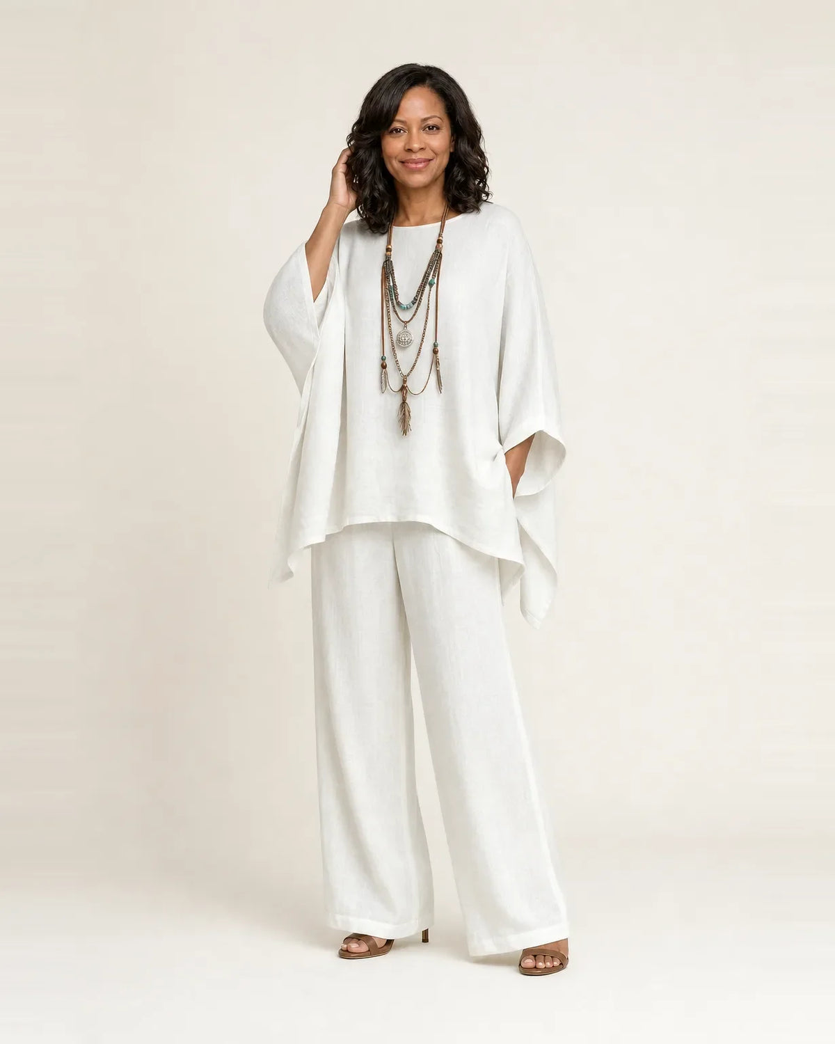 Woman wearing a boho two piece set with an oversized asymmetric top and wide-leg pants - view 2