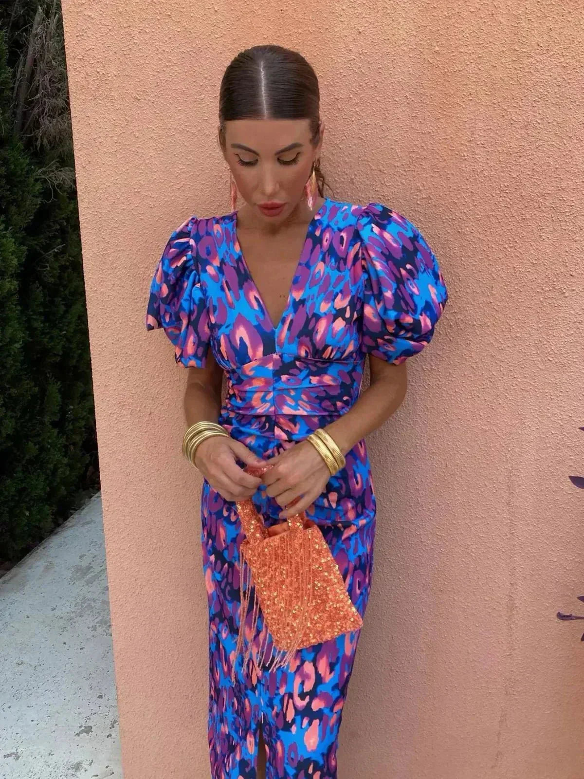 Woman wearing a printed puff sleeve V-neck midi dress with ruched waist - view 2
