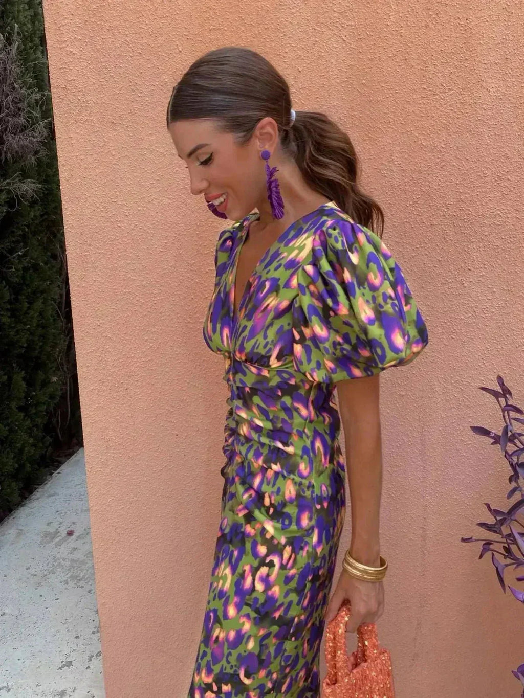 Woman wearing a printed puff sleeve V-neck midi dress with ruched waist - view 3