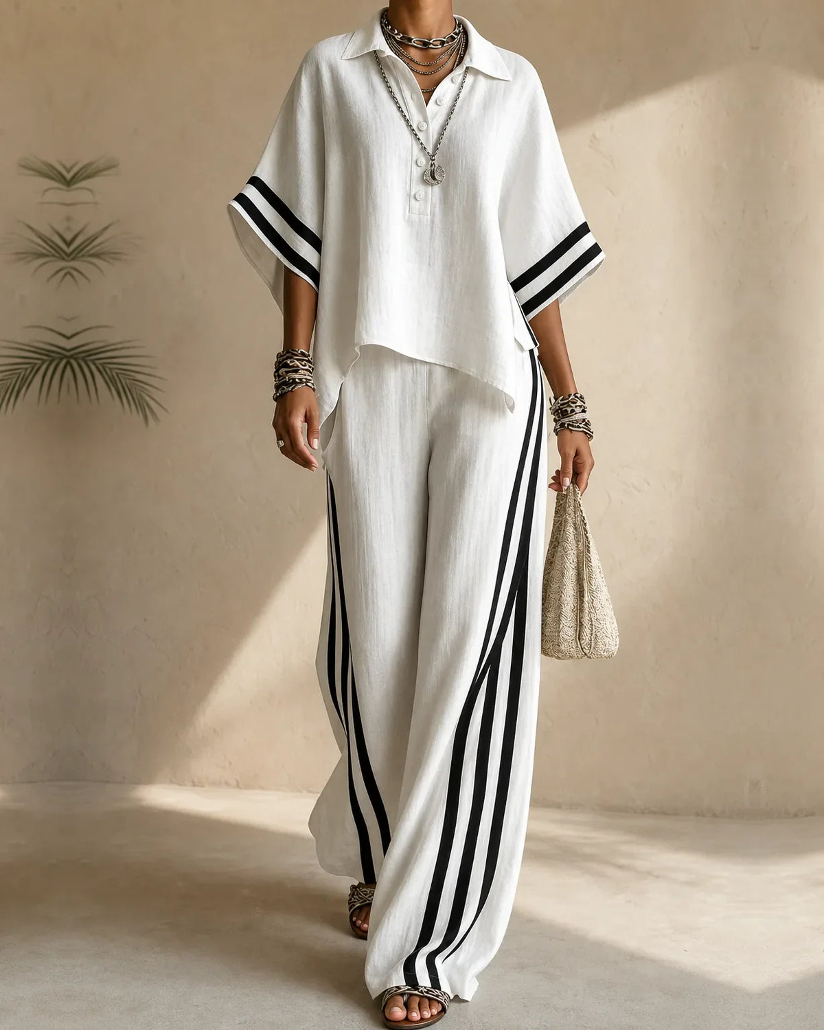 Woman wearing a side stripe two piece set with polo collar top and wide leg pants - view 2
